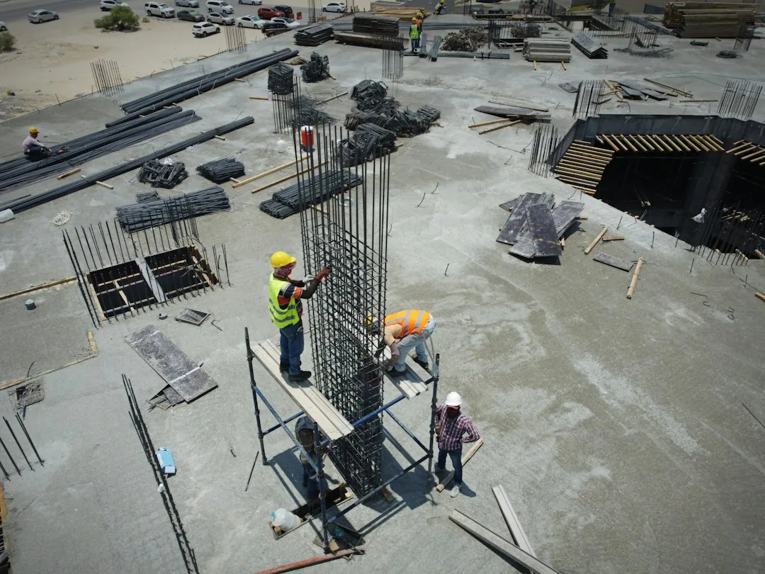 Workers at an active construction site, editorial photograph by Glenov Brankovic