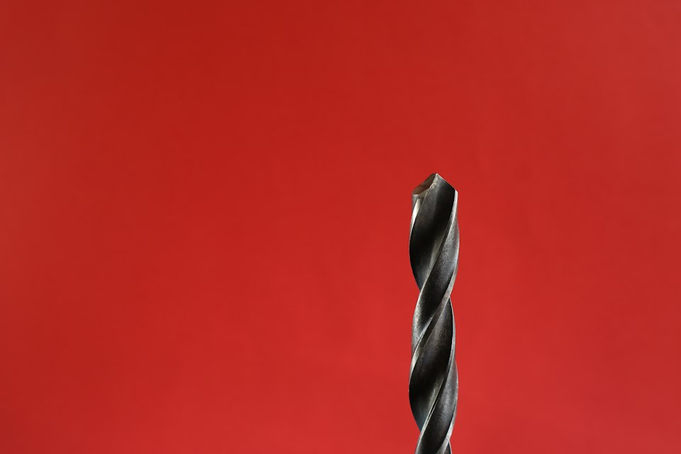 Drill-bit close-up to illustrate checking tip and shank geometry before drilling