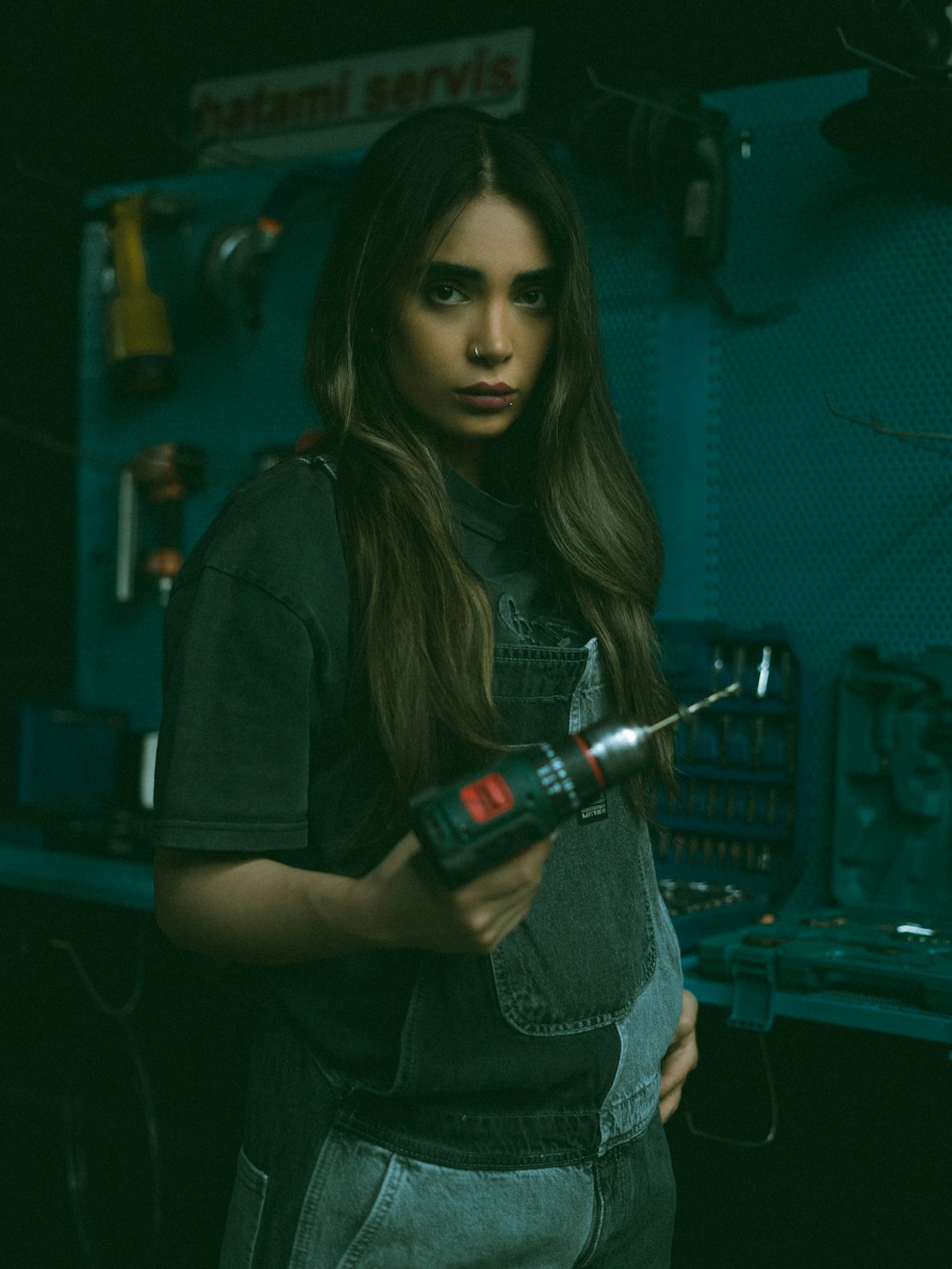 Woman working with tools in a workshop, illustrative lifestyle photography