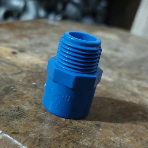 Actual blue PVC-U male threaded pipe adapter with embossed 20mm and 1/2 inch markings